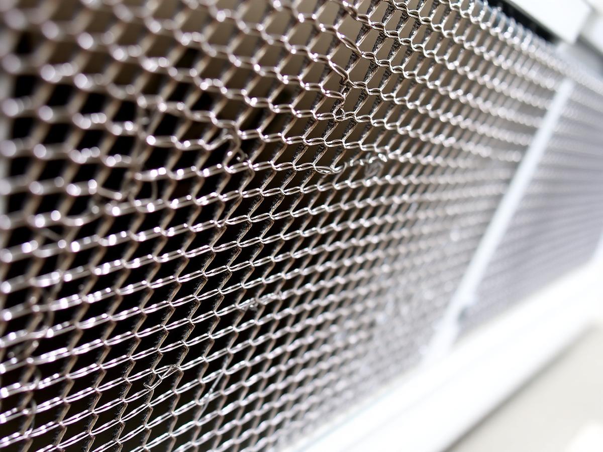 Ember-resistant vent mesh detail